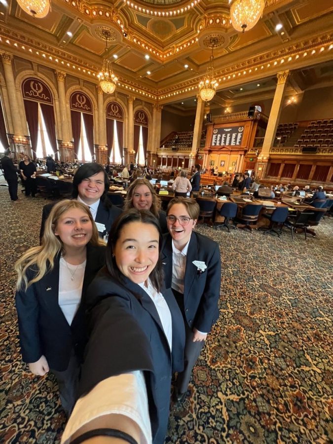 Some fellow House Pages and I posed on our second day of the session while Governor Kim Reynolds practiced her Condition of the State Address. If you look very closely, the black dot in the back center of the photo is the Governor. 
