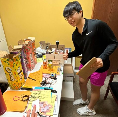 Student Council President Mason Stokes preparing for the delivery of the “Crush Cans,” provided by the North Polk Student Council Instagram account. 