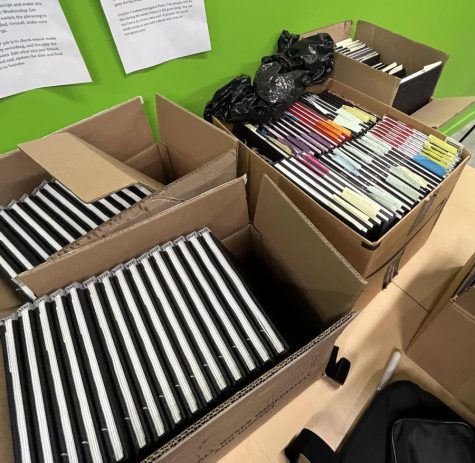 Boxes on boxes of yearbooks ready for pick-up that can be found in the green-screen room next to Mrs. Triers’s room.