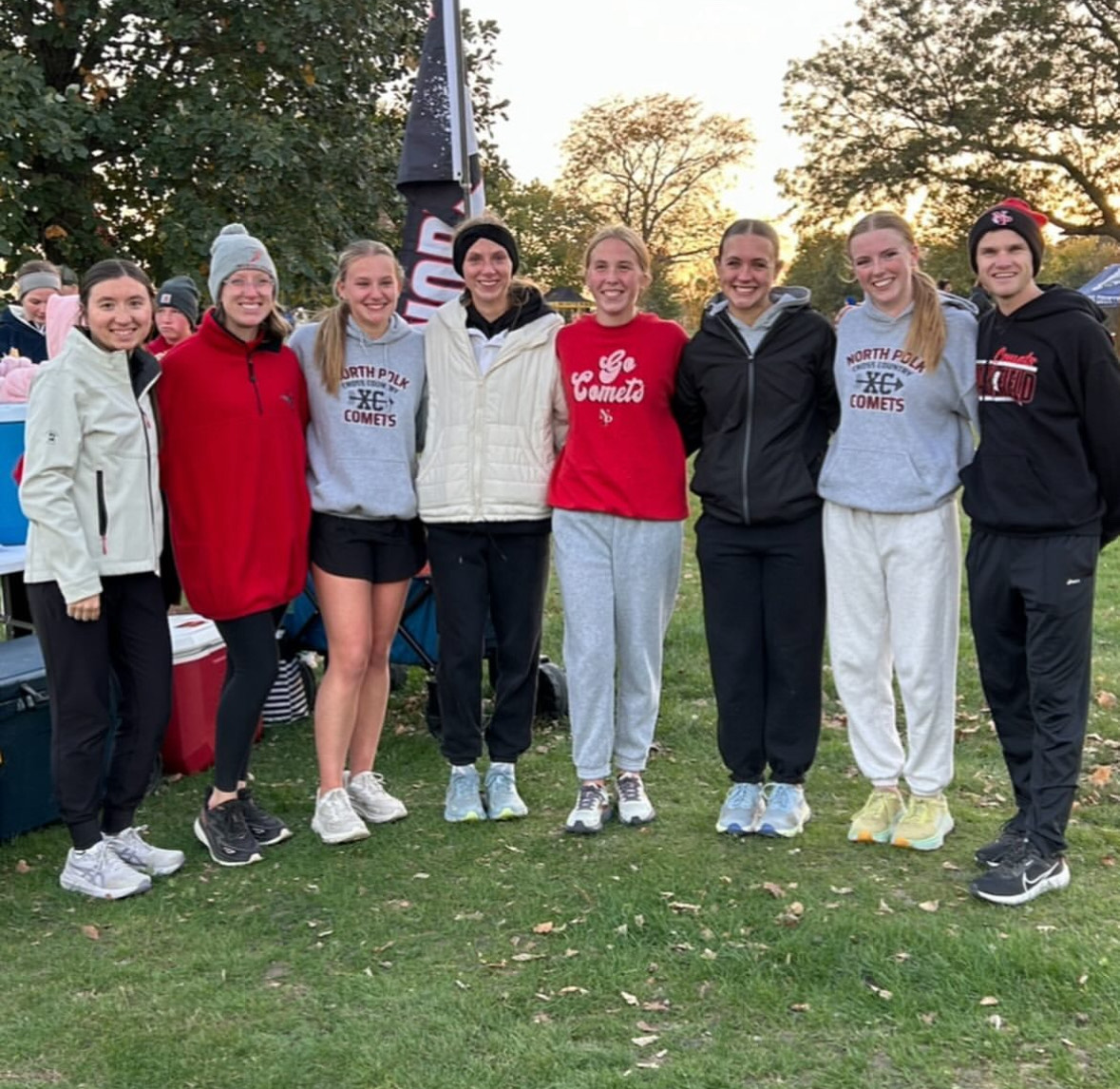 Photo of the cross-country team’s seniors with their coaches.
