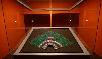 Image of the headdress of Moctezuma, an emperor of the Aztec Empire in Mexico, residing in Vienna, Austria. The Mexican government has continued to ask for the Weltmuseum (World Museum) of Vienna, Austria to give back the  headdress, but it has remained in the museum due to its fragility for travel.  Image from Atlas Oscura. 